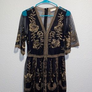 Black and gold lace dress